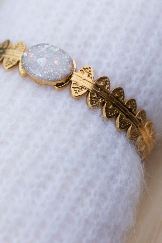 Bracelet jonc réglable pailletté. Blanc, doré, givré,holographique. Automne. Atelier Rézane. Résine époxy. Fait main. Pays basque. Acier inoxydable.
