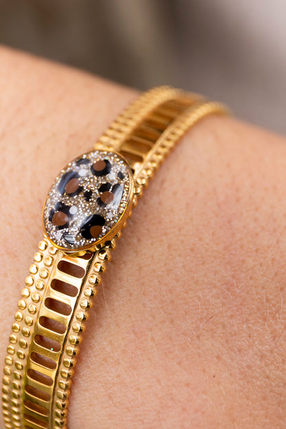 Bracelet jonc réglable pailletté. Noir, doré, holograohique. Automne. Atelier Rézane. Résine époxy. Fait main. Pays basque. Acier inoxydable.
Motifs léopards peints à la main.