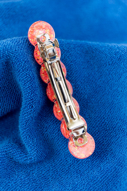 Barrette en résine époxy. Faite à la main. Paillettes, couleurs, originales. Corail incandescent, orange, holographique, étincelant.